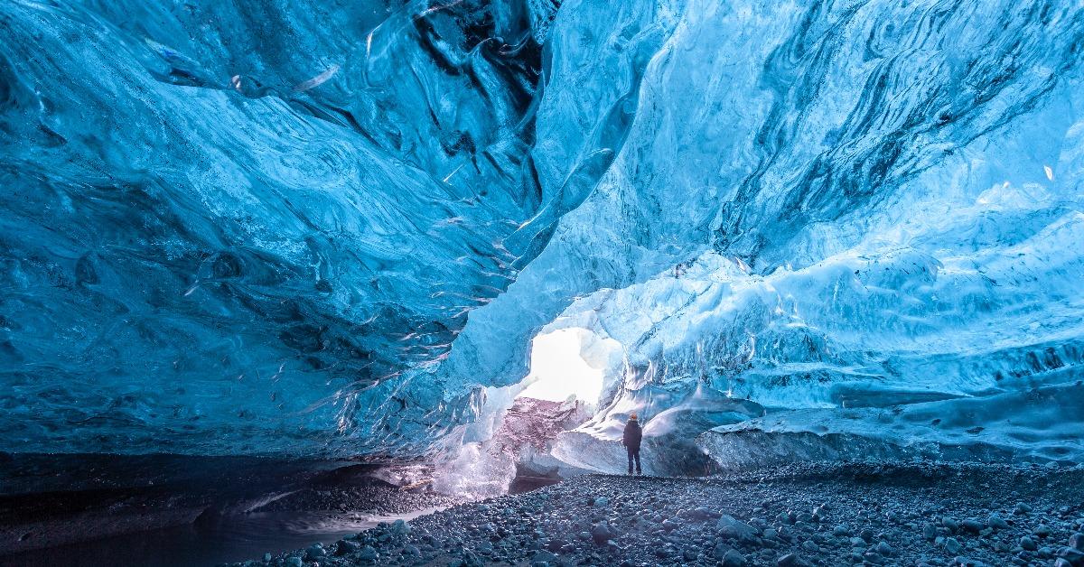 Tourist standing in an ice cave 