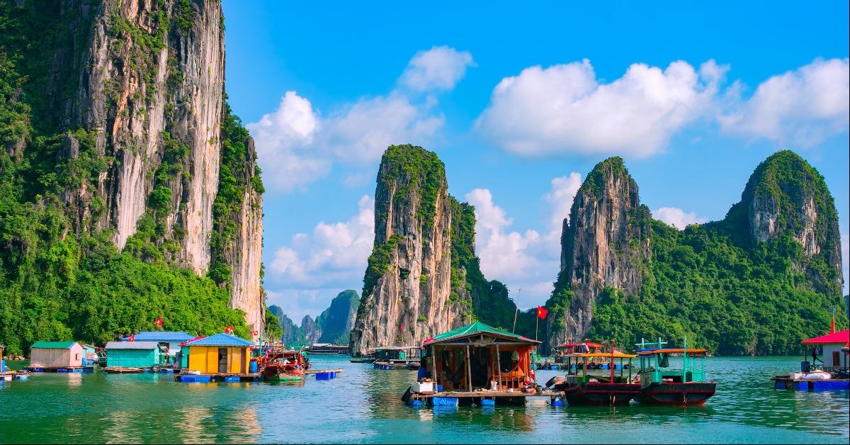 Floating fishing village and rock island in Halong Bay Vietnam