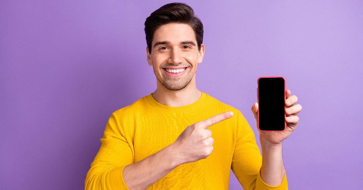 positive man point finger at phone