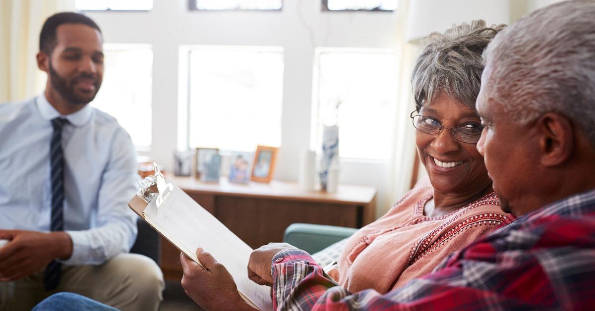 senior couple meeting with male financial advisor 