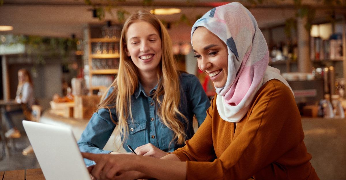 diverse women colleagues meeting in a cafe
