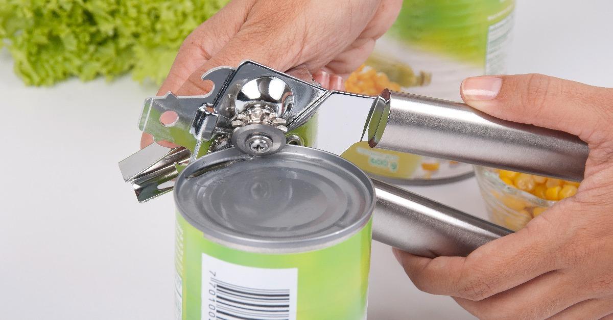 woman hands using a can opener