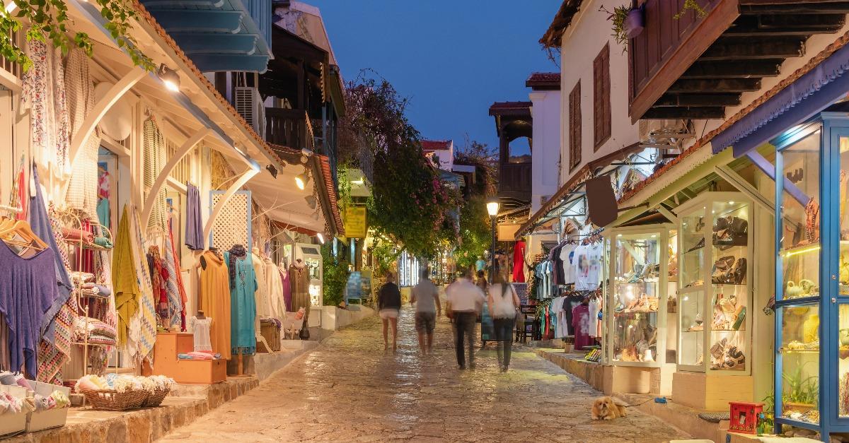 Street view in the Kas old town with boutique shops at evening