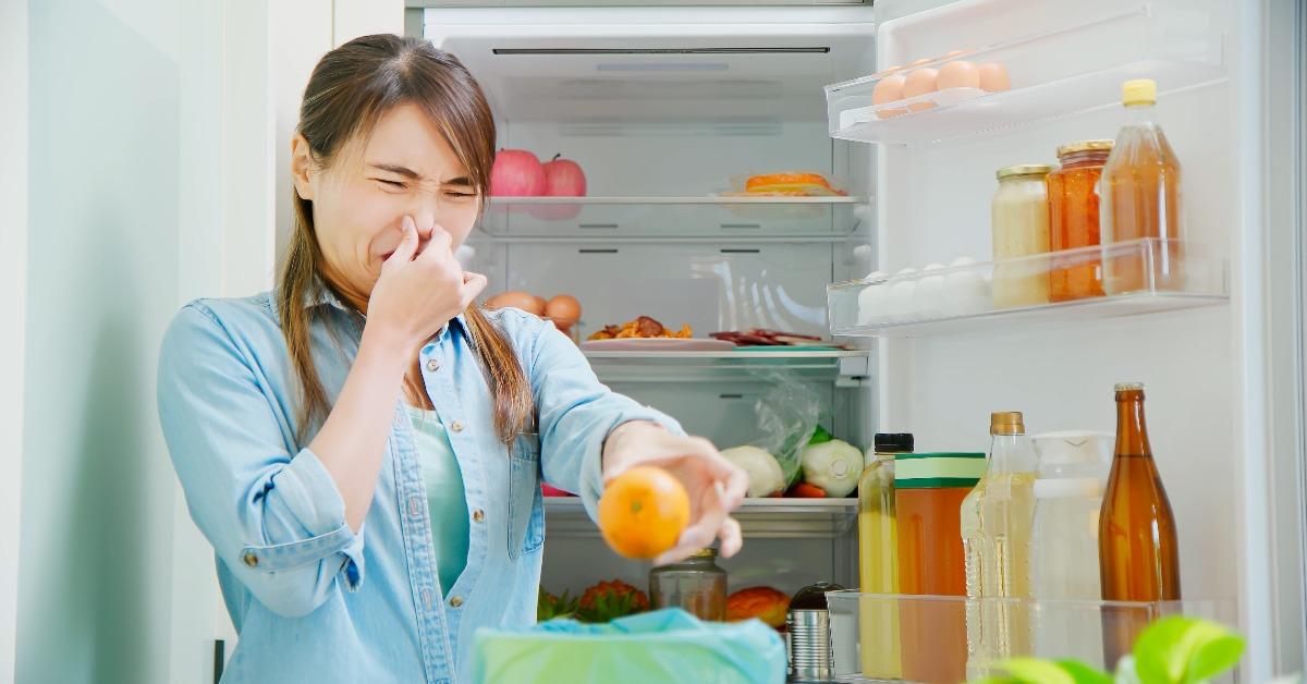 woman is pouring food waste