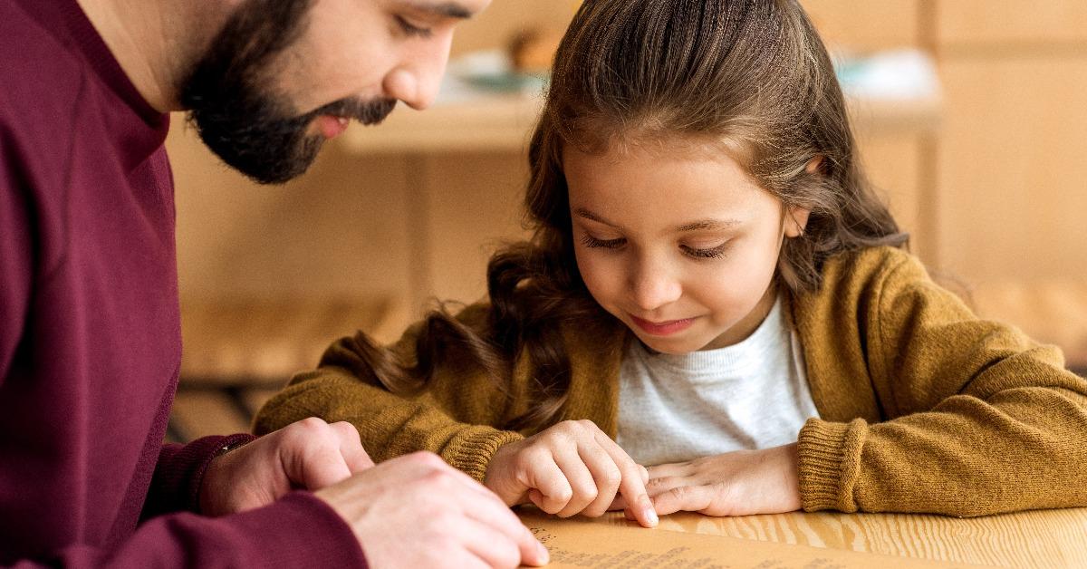 father and daughter choosing food in menu