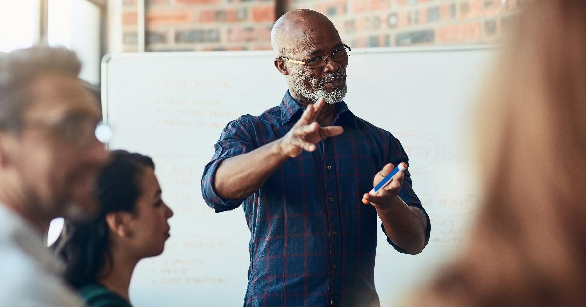 mature businessman giving a presentation in the boardroom