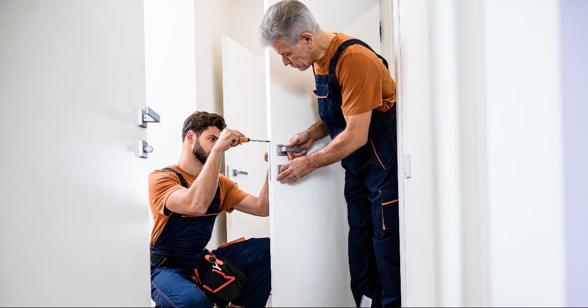 working with house door lock using screwdriver