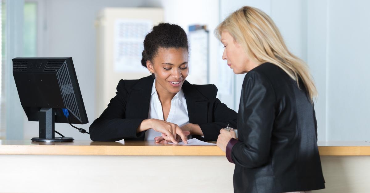 Woman checking into hotel
