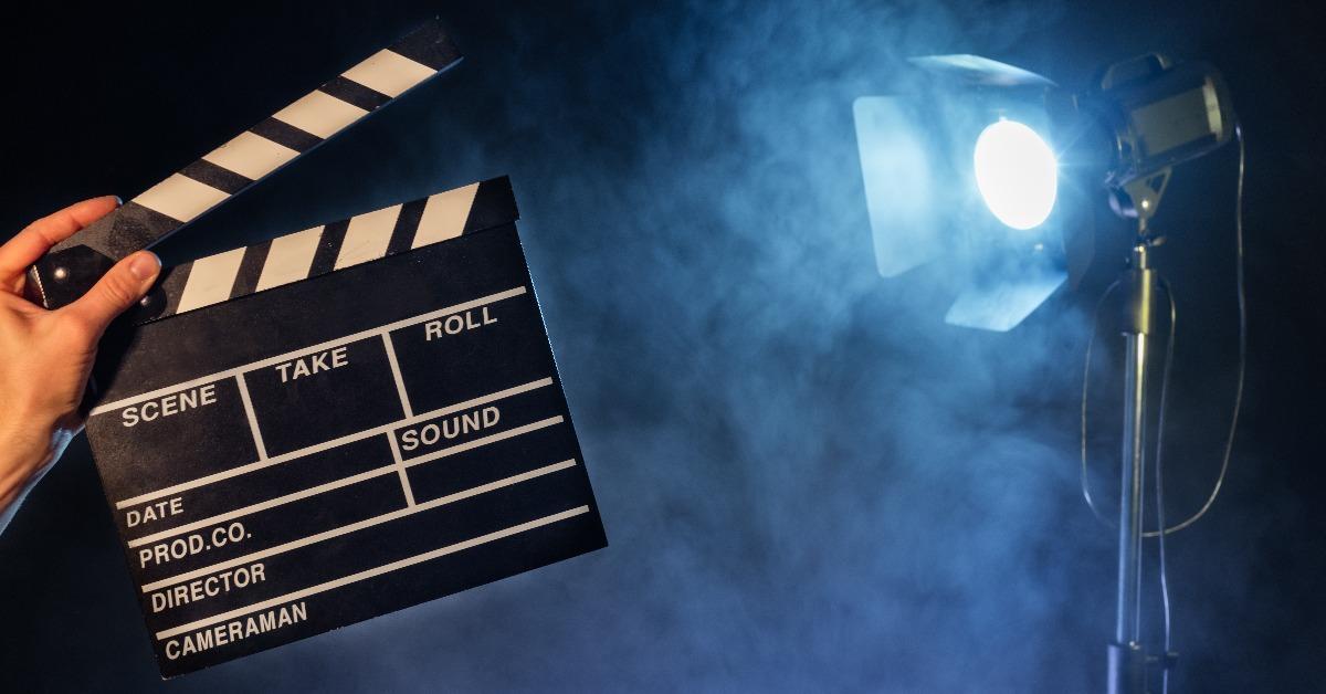 Operator holding clapperboard