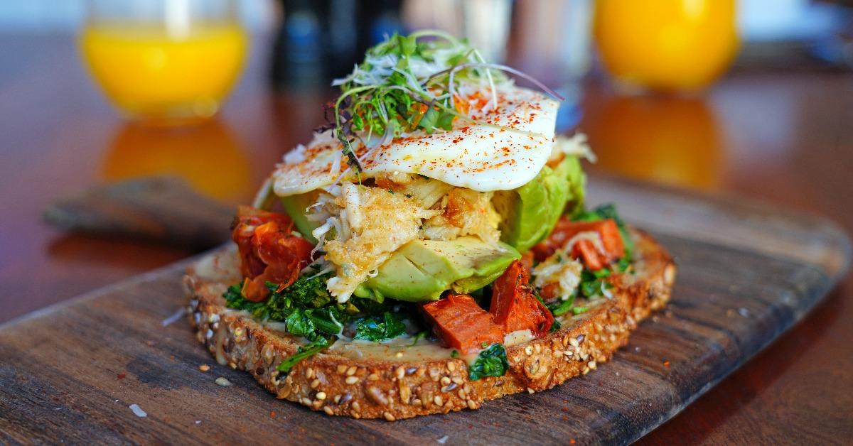 Multigrain avocado toast with fried egg on top