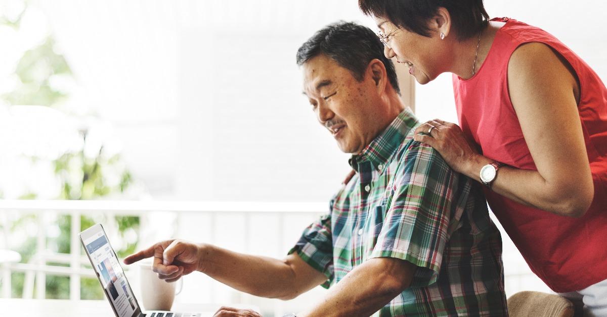 elderly senior couple computer home
