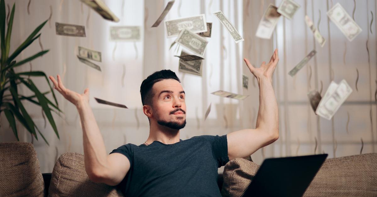 man making money from home on his laptop