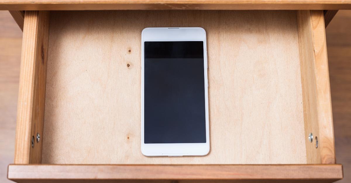 mobile phone in open drawer