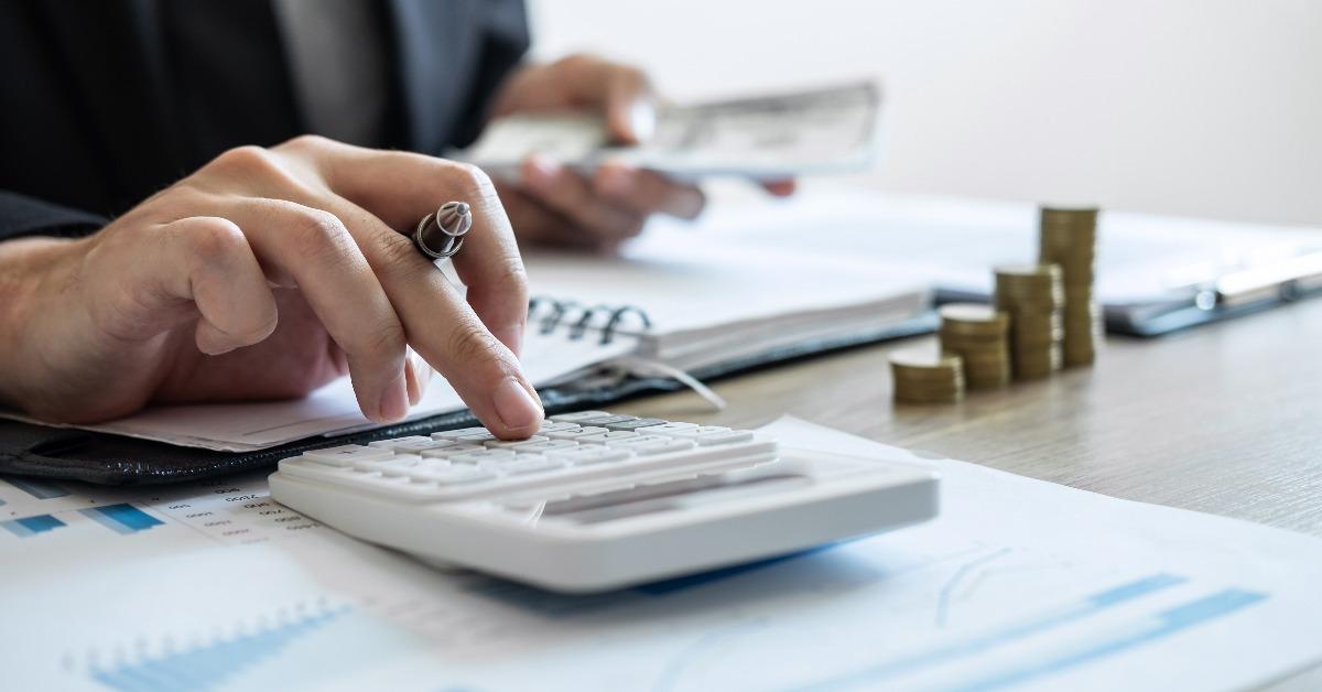  accountant counting money and making notes report doing finance