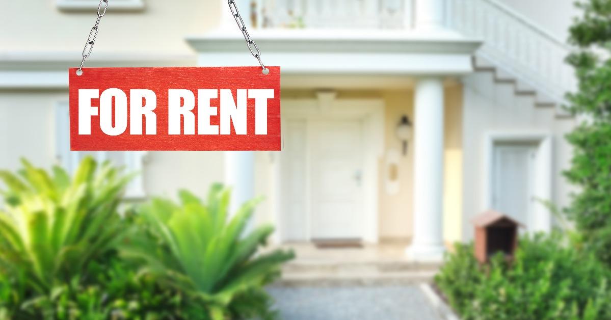 Real estate sign in front of new house for rent