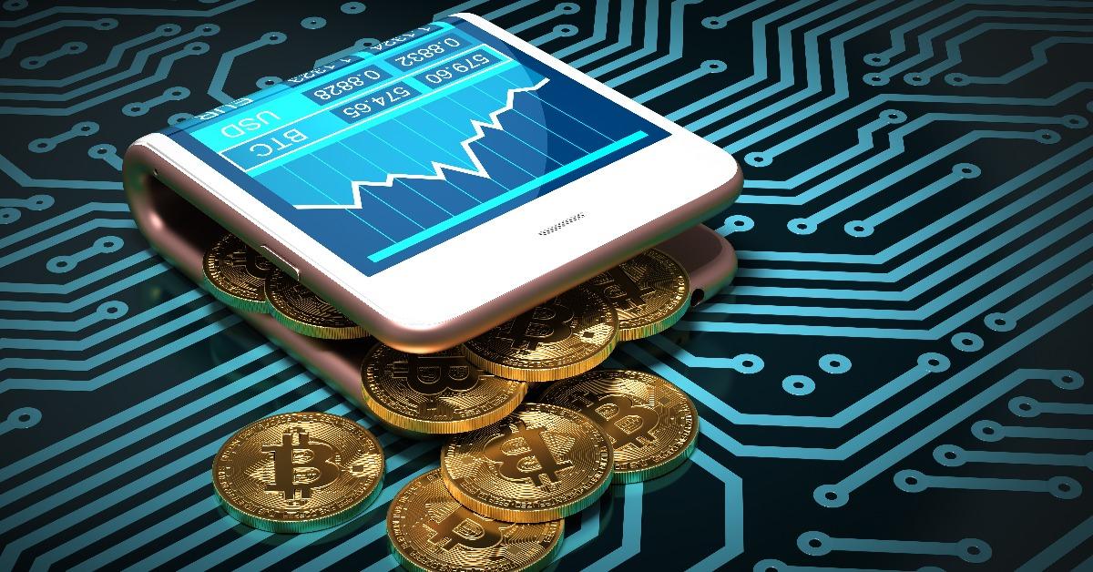 digital wallet and bitcoins on printed circuit board