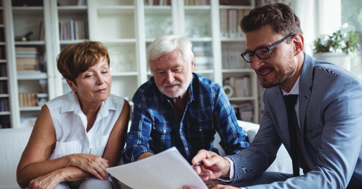 Senior couple planning their investments with financial advisor