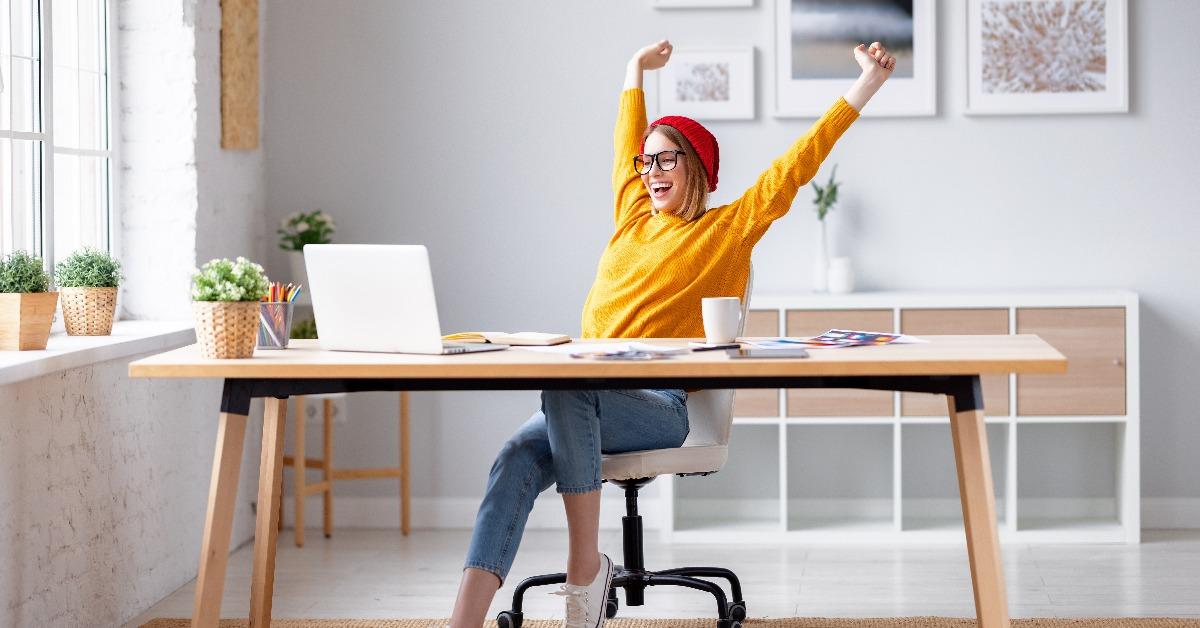 happy female designer finishing work