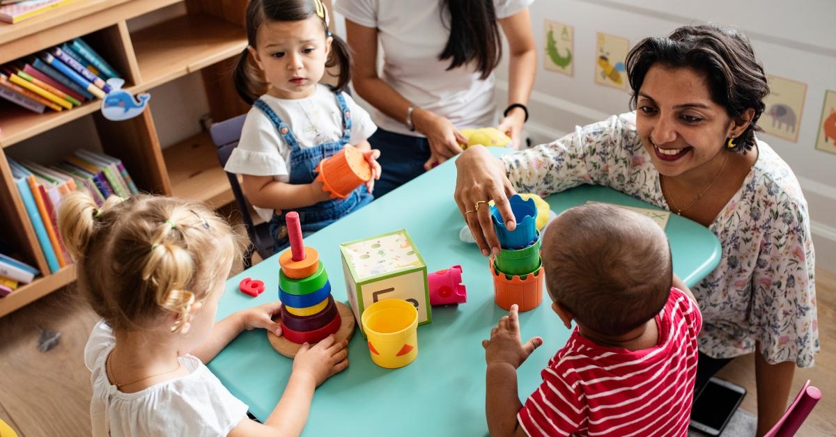Children playing with teacher