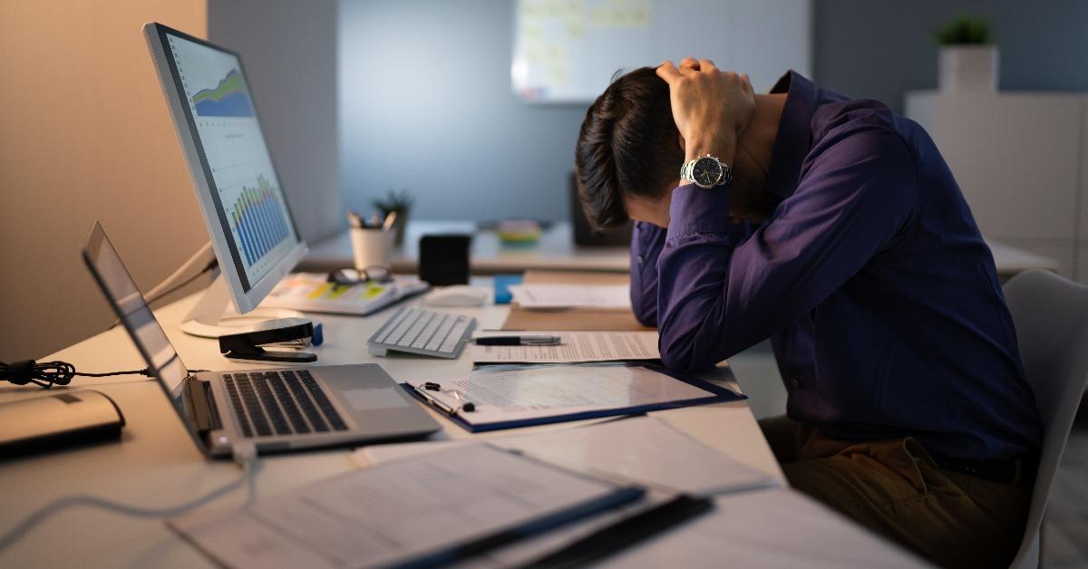 stressed accountant working late in office 