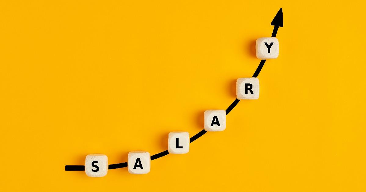 Salary raise or wage increase concept with the word salary written on wooden blocks