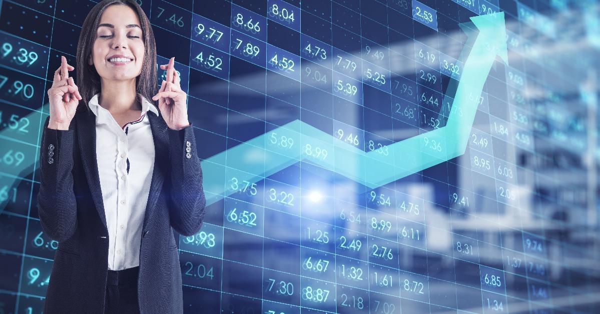 businesswoman with crossed fingers with index data on background