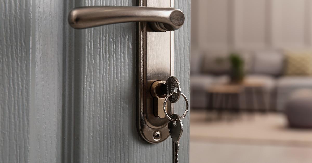 open door with key in room