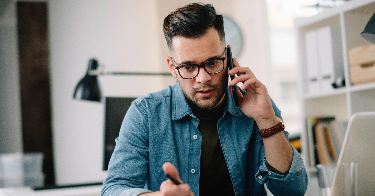 man talking on phone at work