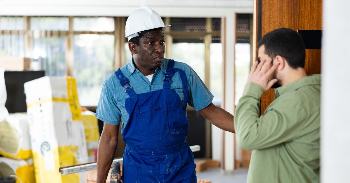 confused construction worker with pneumatic hammer drill 