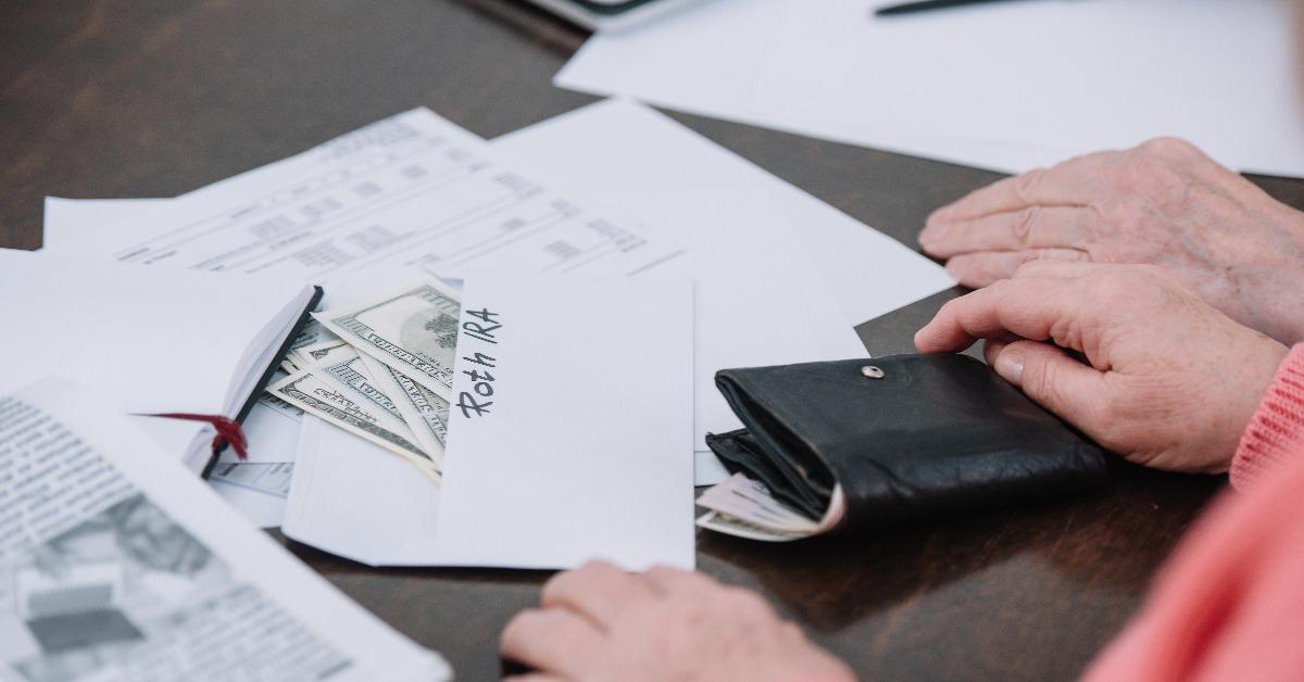  senior couple sitting at table with paperwork