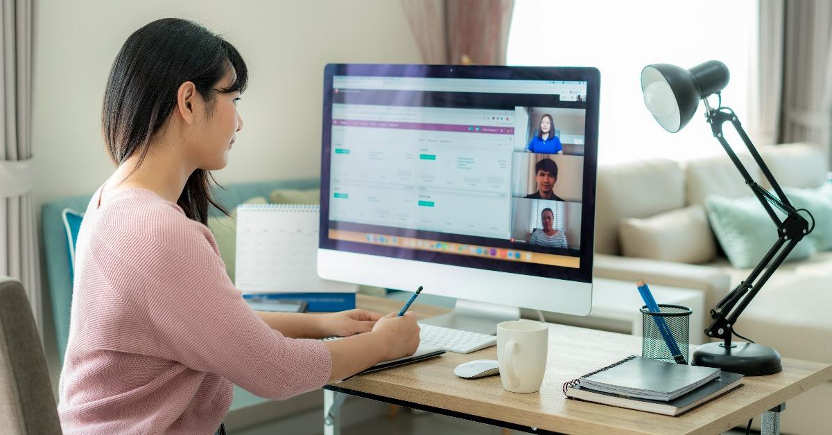 woman talking to her colleagues about plan in video conference