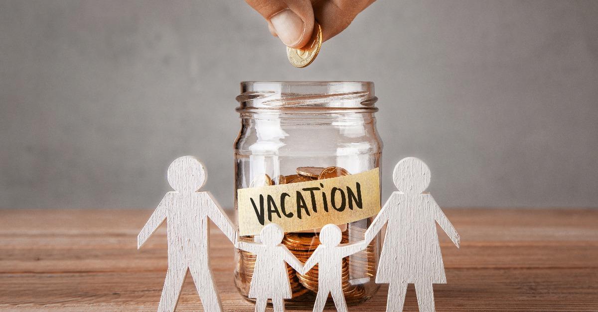 glass jar with coins an inscription vacation and symbol of family with children