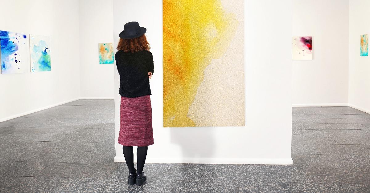young woman in modern art gallery