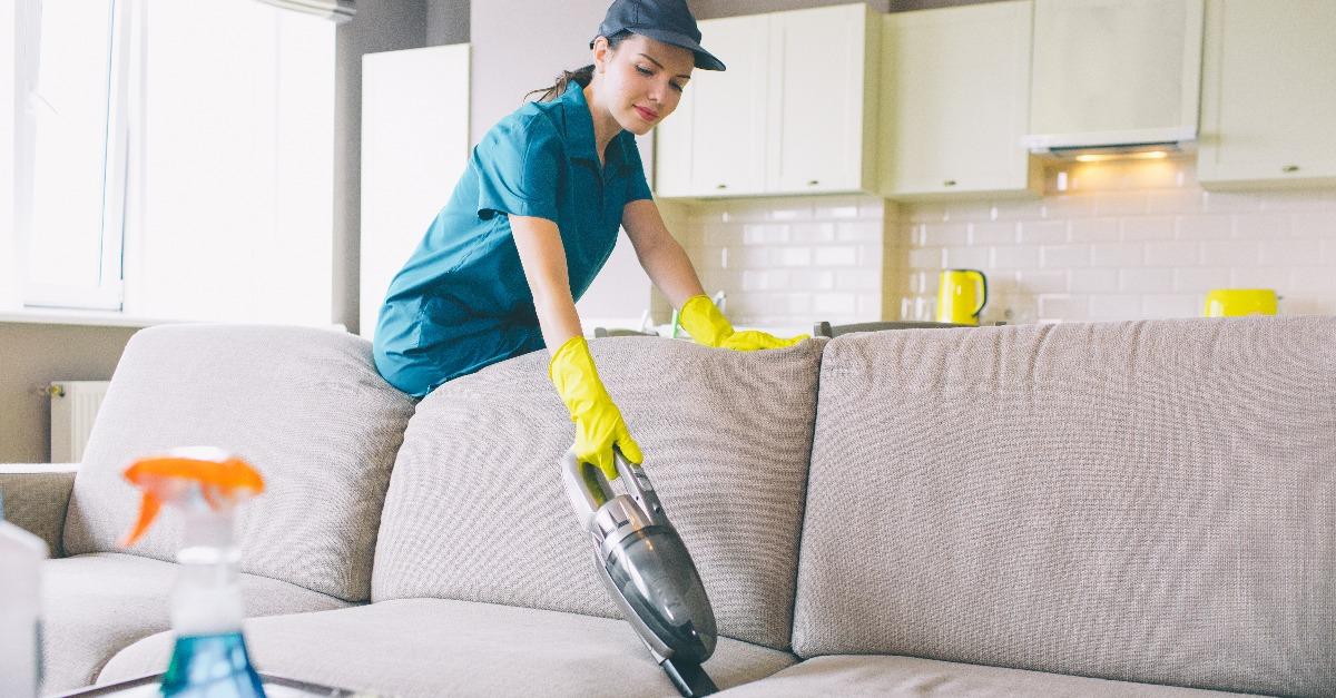 woman works with small vaccuum cleaner