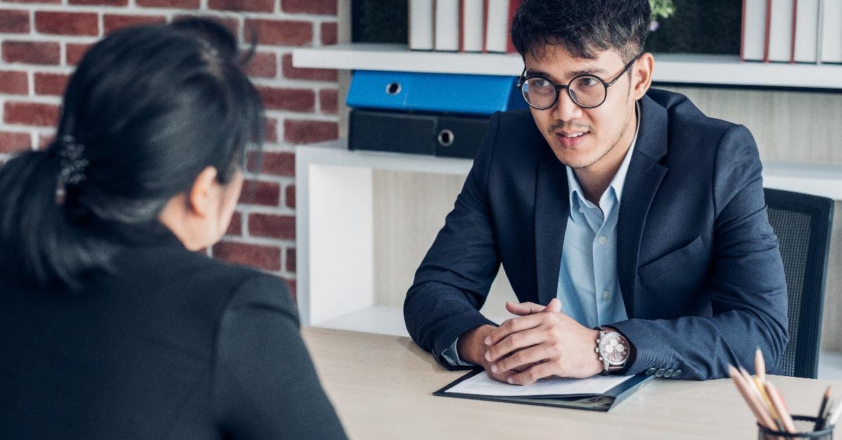 businessman and businesswoman talking about business agreement