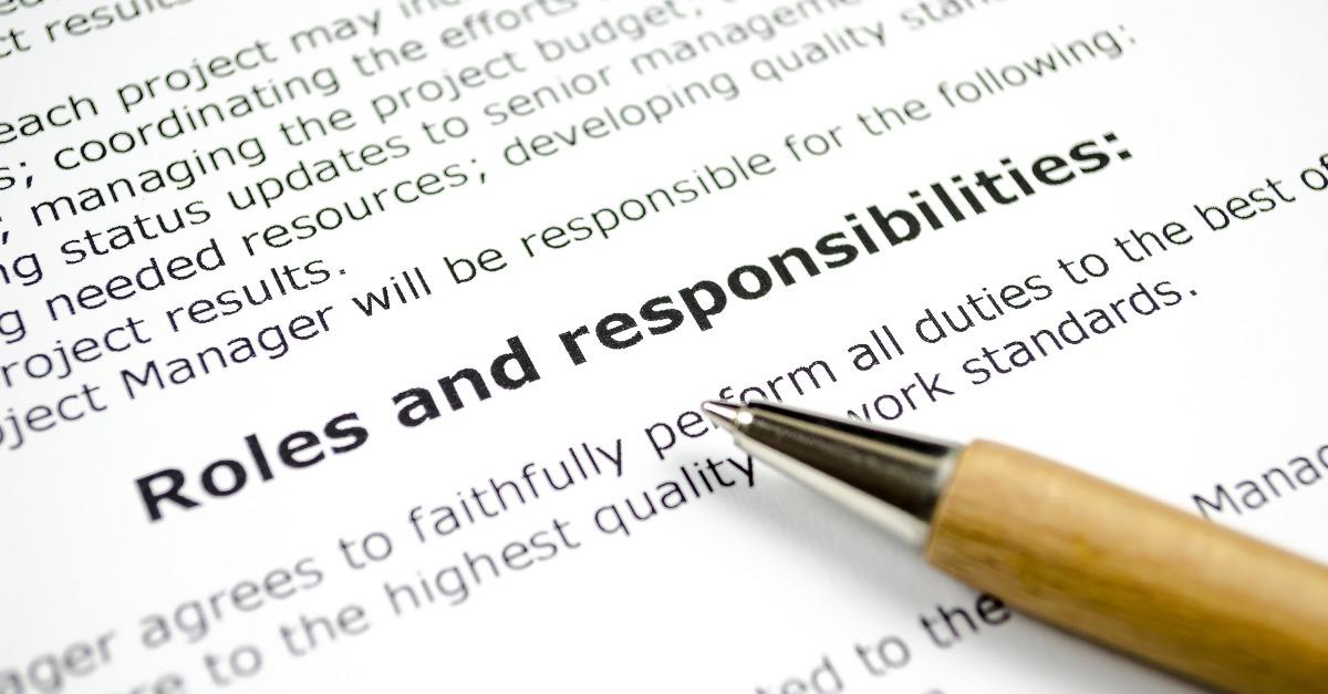 roles and responsibilities with wooden pen