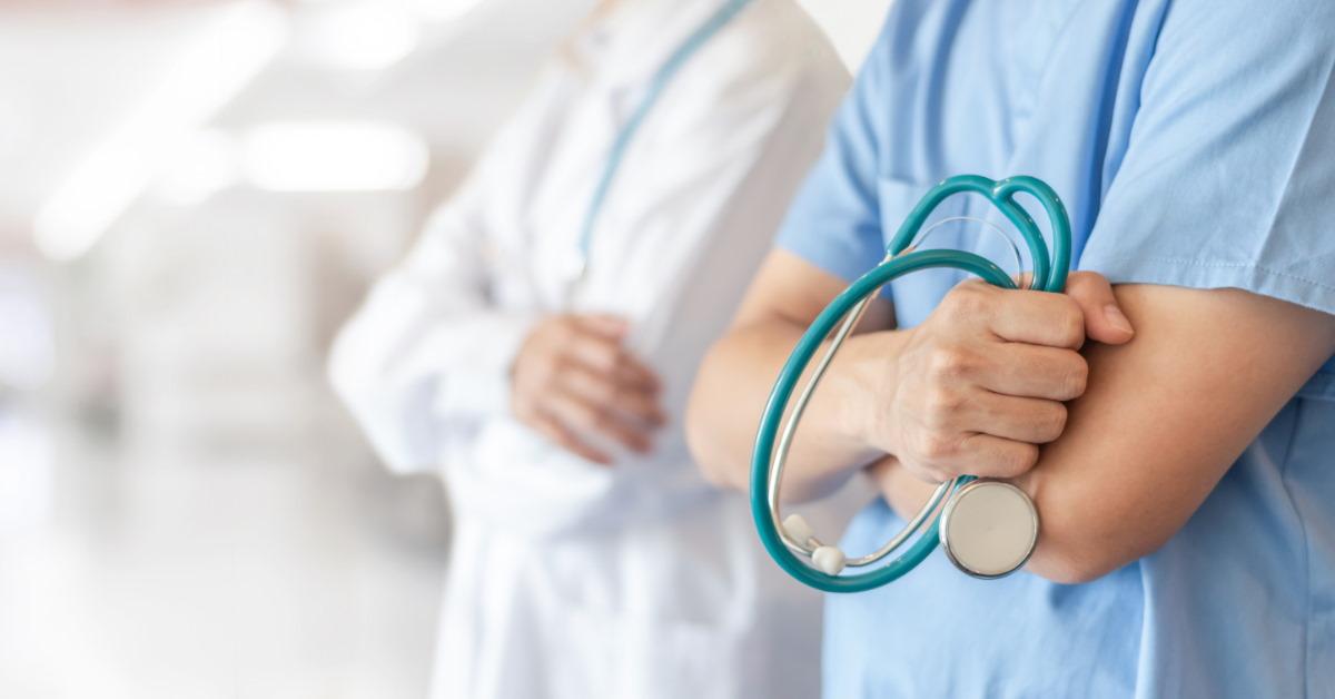 medical professionals holding stethoscope