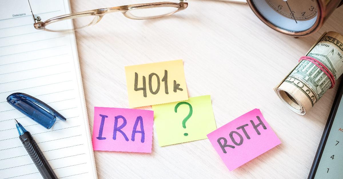 401k ira roth on pieces of colorful paper