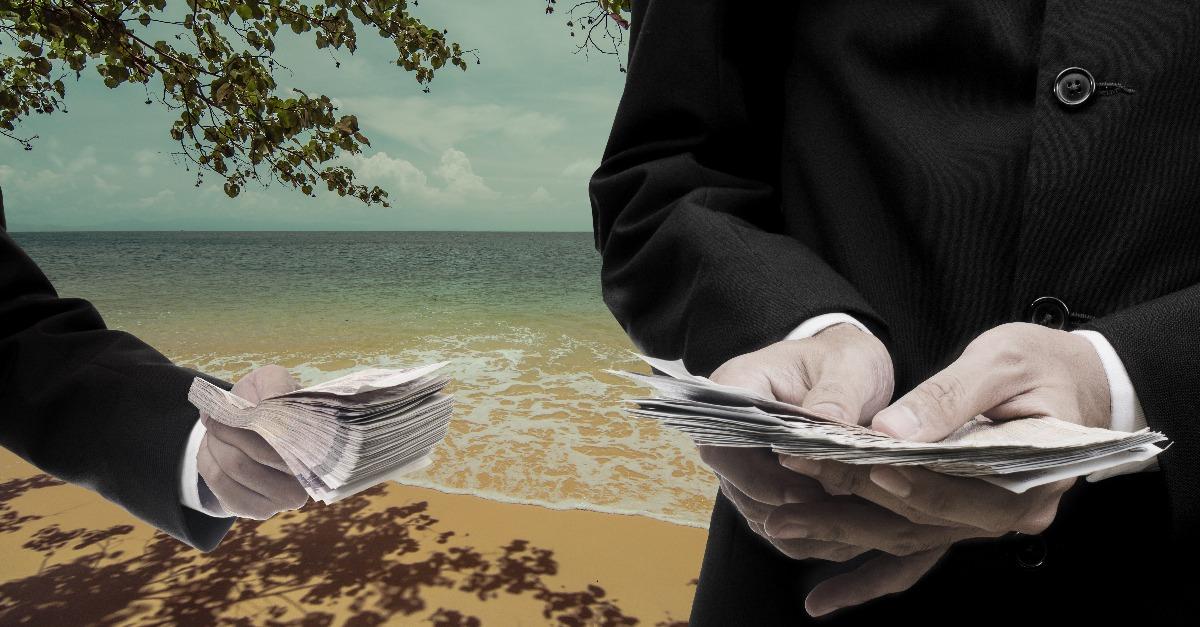 businessmen counting money with beach at the background