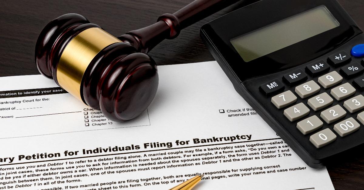 bankruptcy petition for individuals with calculator and gavel