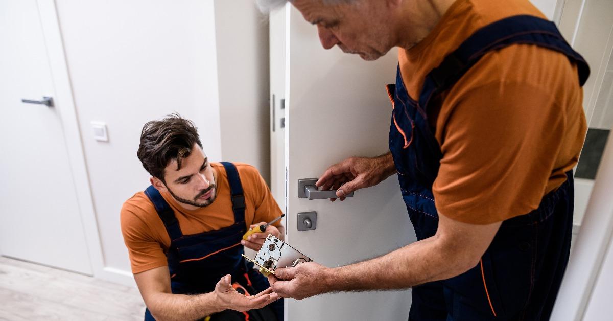 working with house door lock using screwdriver