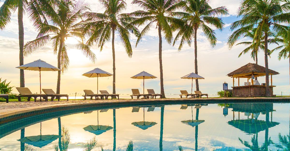 luxury umbrella and chair around outdoor swimming pool in hotel and resort