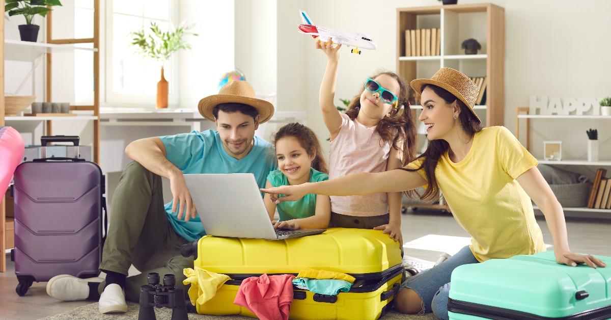 family and daughter children buying payment for flight ticket