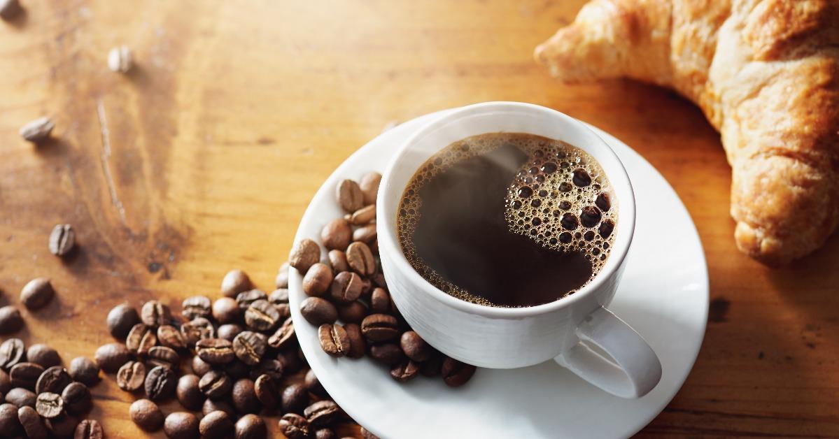 cup of hot coffee on wooden table