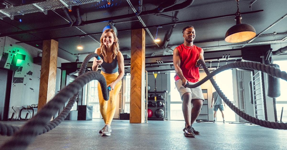 functional training with battle rope in crossfit gym for better fitness