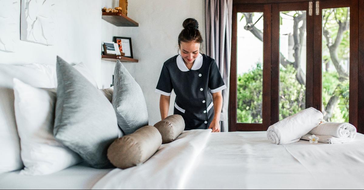 housekeeper cleaning a hotel room