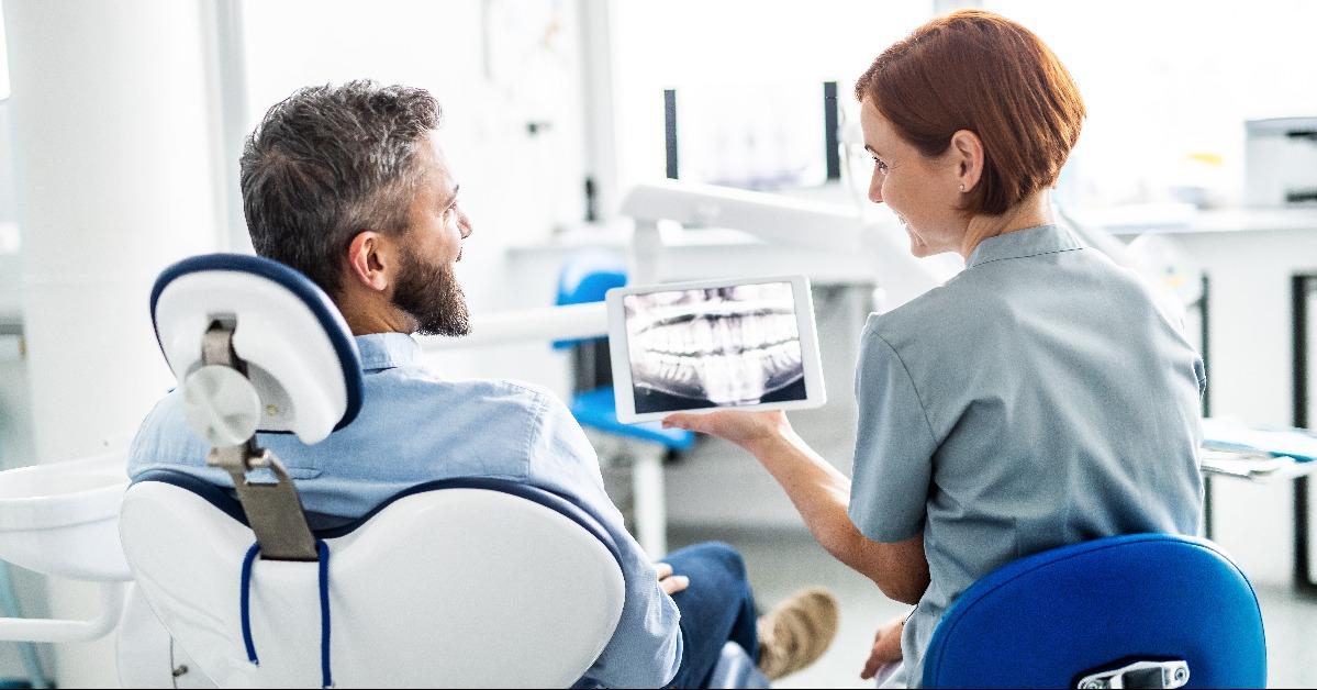 man and dentist in dental surgery