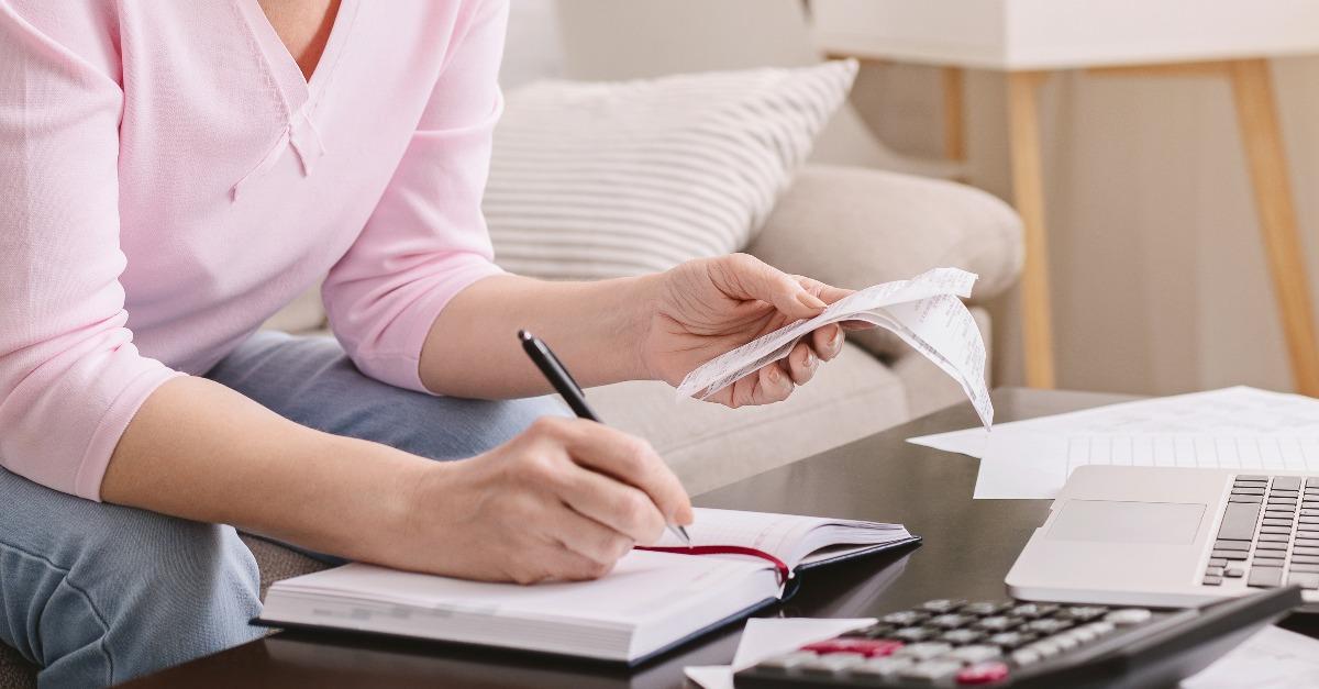 woman bookkeeping bills and payments at home