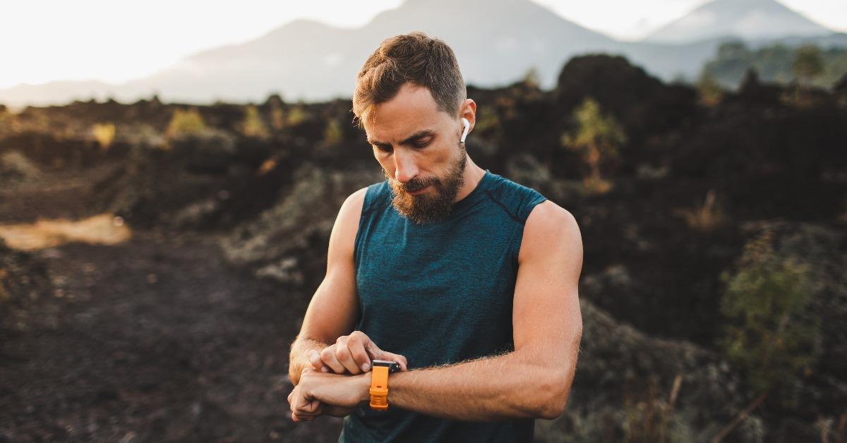 runner checking training results on smart watch