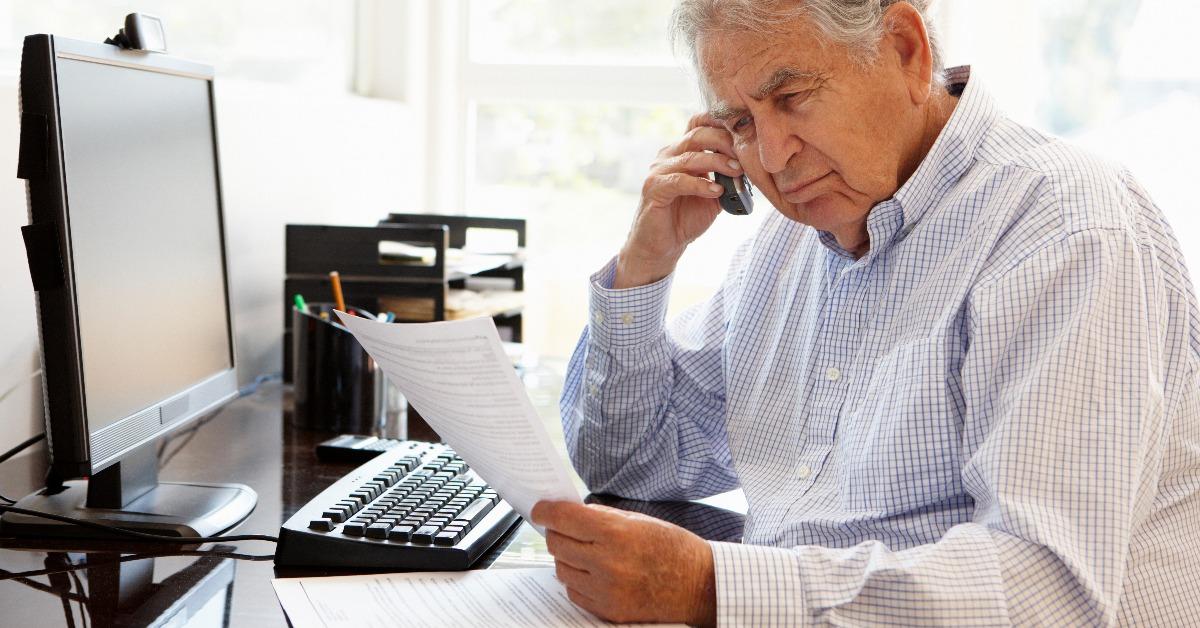 senior man working on computer at home